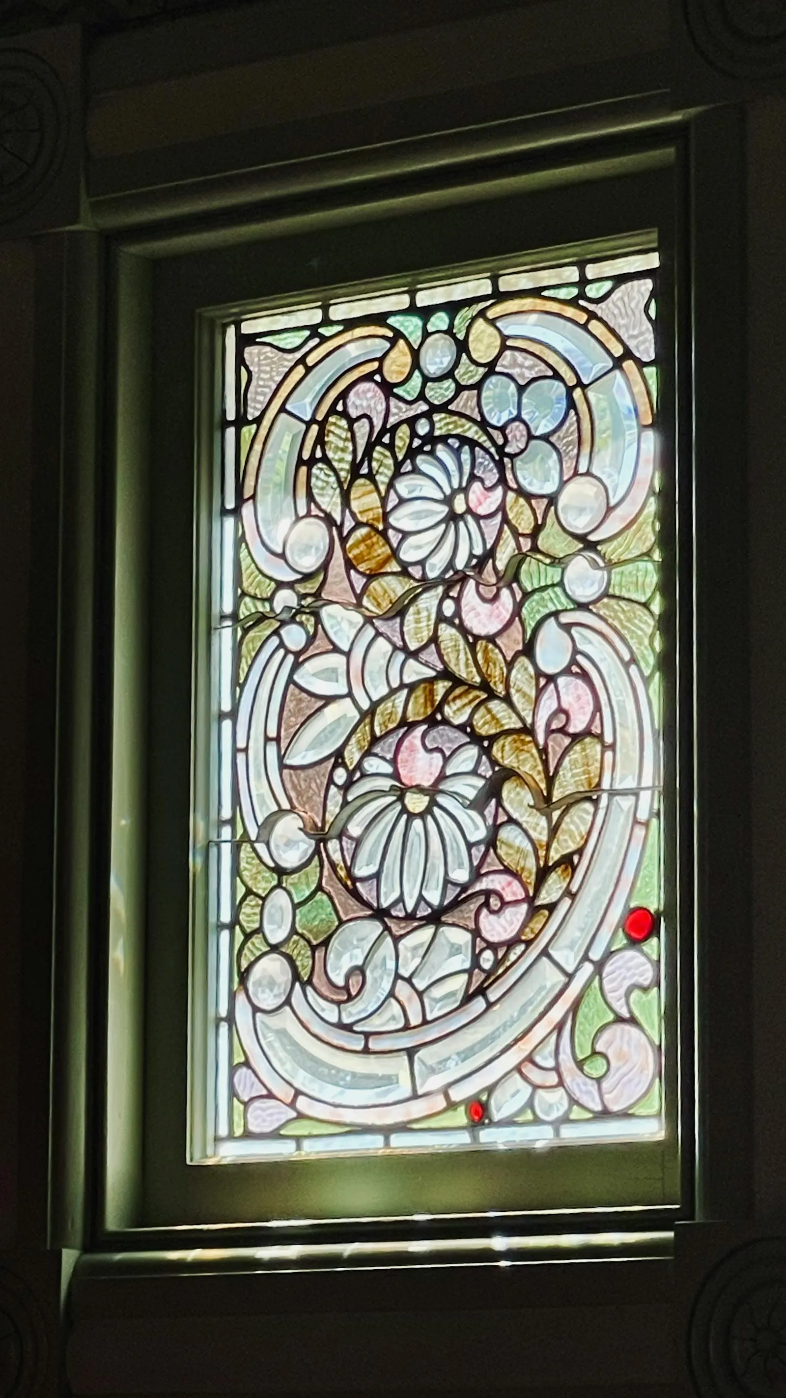 Elegant heritage stained-glass window with leadlight floral and geometric design typical of pre-1940 Adelaide homes